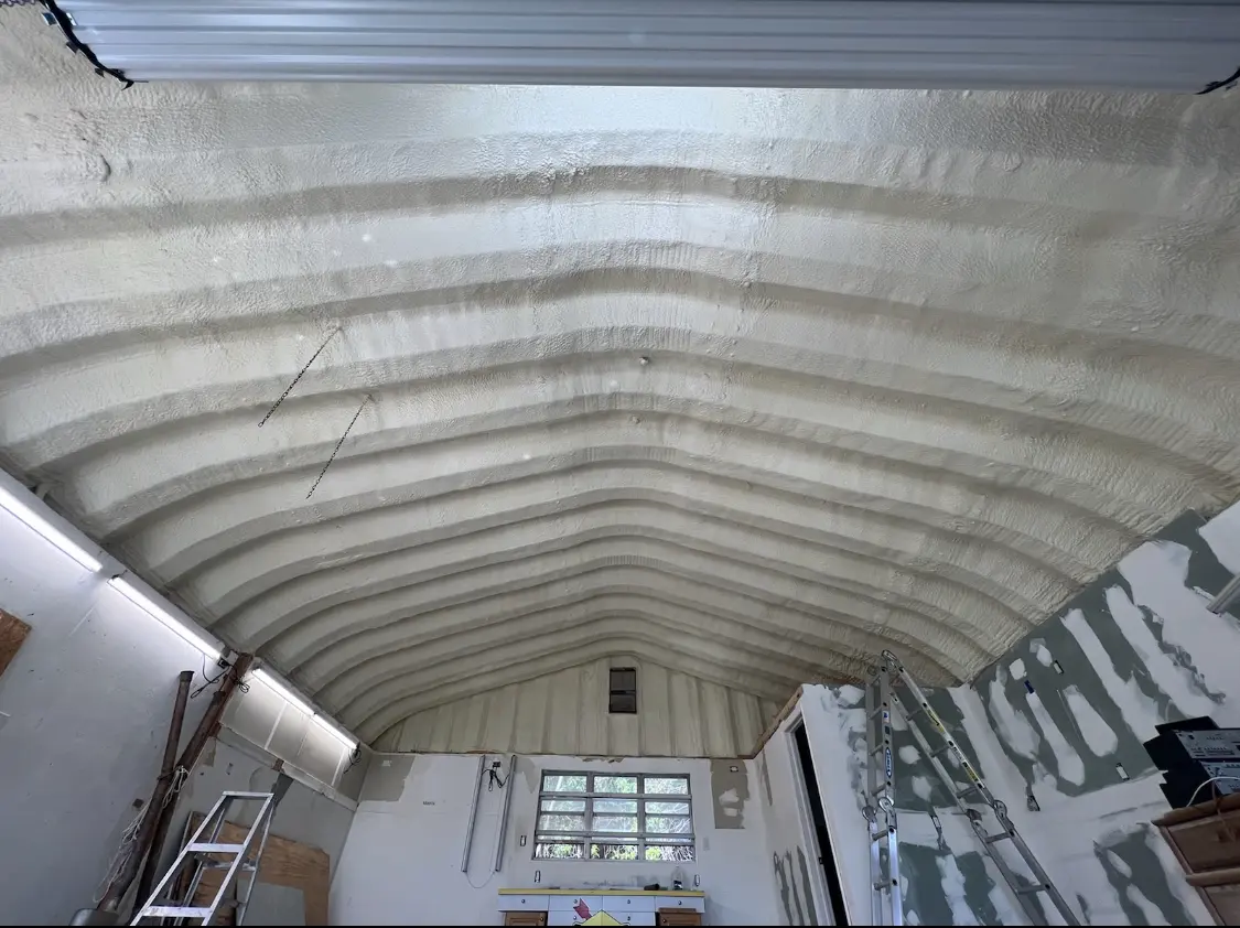 Spray polyurethane foam applied to the underside of a metal roof deck in Notre Dame